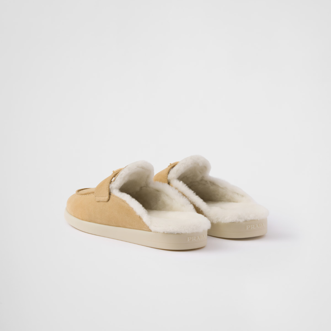 Suede and shearling mules – upper with leather band Enameled metal triangle logo Rubber sole, 25 mm – LUX VERSE Luxury Designer Fashion Outlet