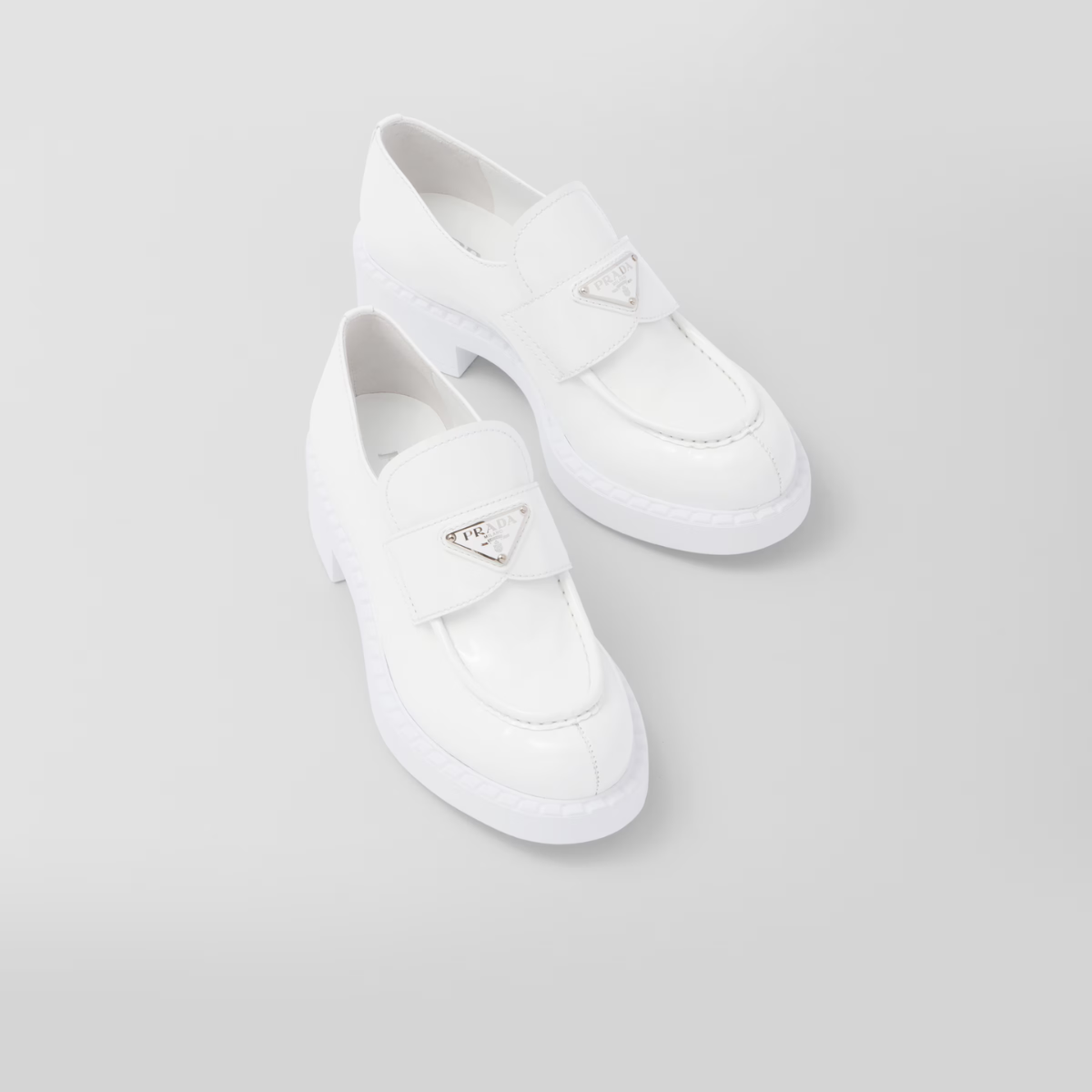 patent leather loafers – the triangle logo, first introduced on trunks designed by Mario, decorates the front – LUX VERSE Luxury Designer Fashion Outlet