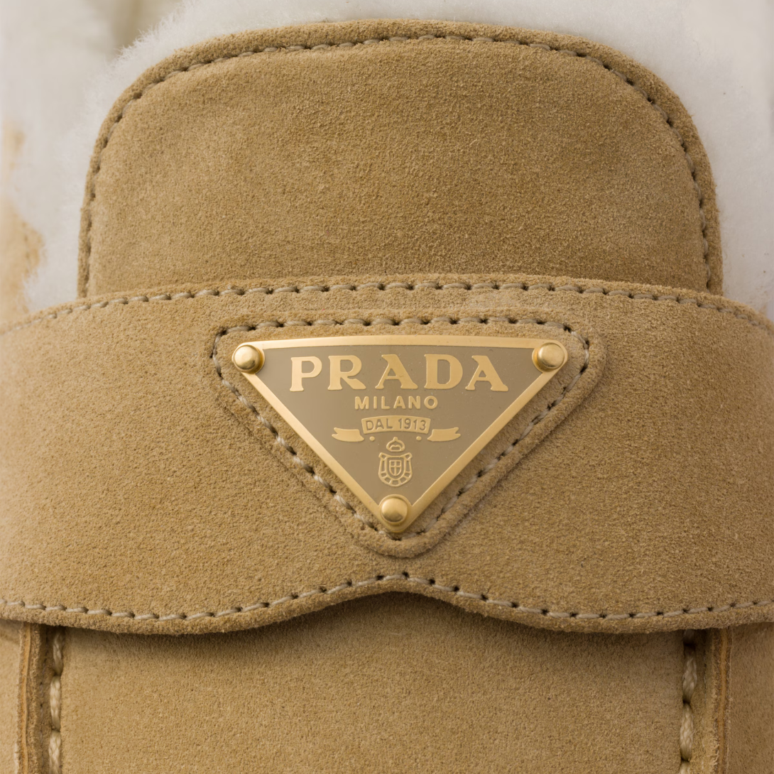 Suede and shearling mules – upper with leather band Enameled metal triangle logo Rubber sole, 25 mm – LUX VERSE Luxury Designer Fashion Outlet