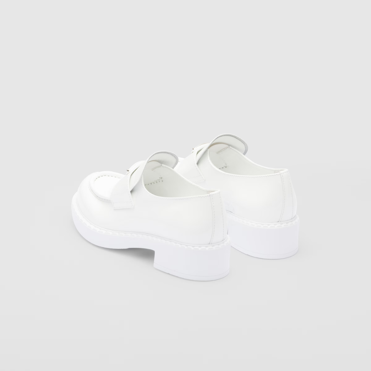 patent leather loafers – leather band on the upper Apron with stitched, raised edge Enameled metal triangle – LUX VERSE Luxury Designer Fashion Outlet
