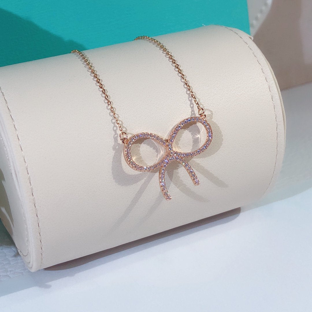 Claw Set Rhodium Plated Bow Necklace – LUX VERSE Luxury Designer Fashion Outlet