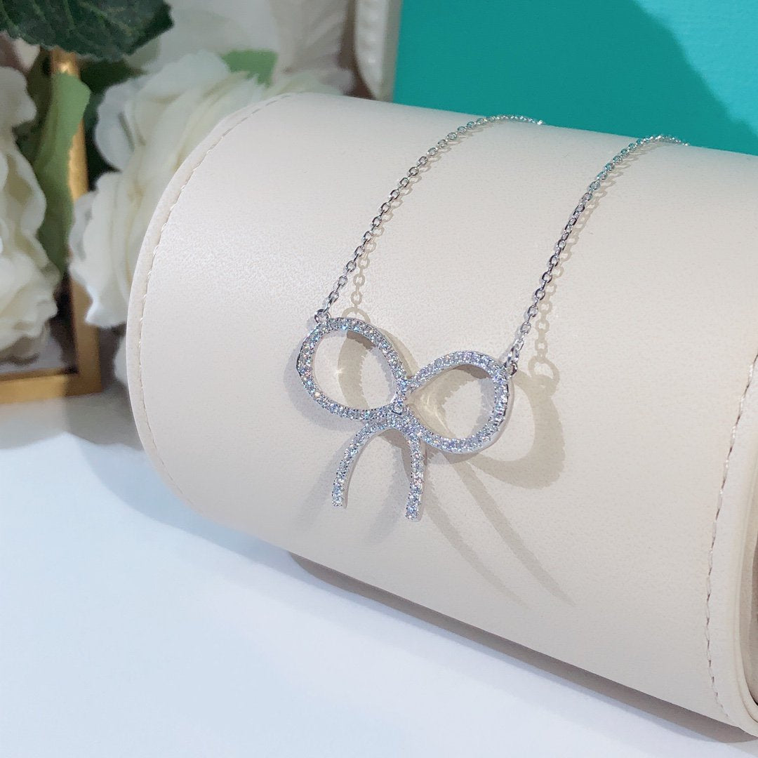 Claw Set Rhodium Plated Bow Necklace – LUX VERSE Luxury Designer Fashion Outlet