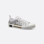 Low-Top Sneaker – essential details, such as eyelets and a lace-up front, a white and beige rubber – LUX VERSE Luxury Designer Fashion Outlet