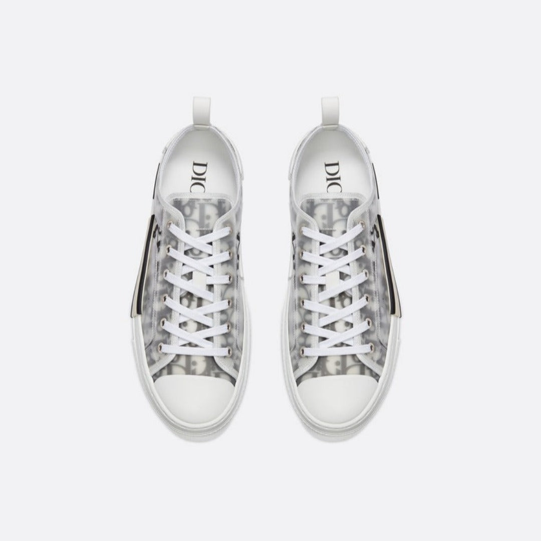 Low-Top Sneaker – the B23 low-top sneaker is set apart by its white and black Oblique motif and – LUX VERSE Luxury Designer Fashion Outlet