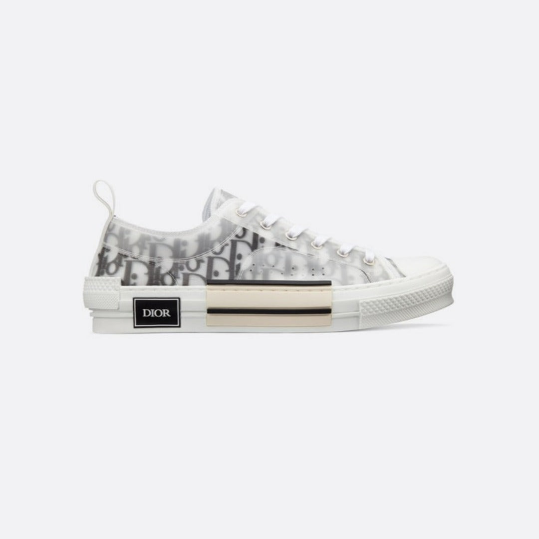 Low-Top Sneaker – the B23 low-top sneaker is set apart by its white and black Oblique motif and – LUX VERSE Luxury Designer Fashion Outlet