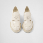 patent leather loafers – the triangle logo, first introduced on trunks designed by Mario, decorates the front – LUX VERSE Luxury Designer Fashion Outlet