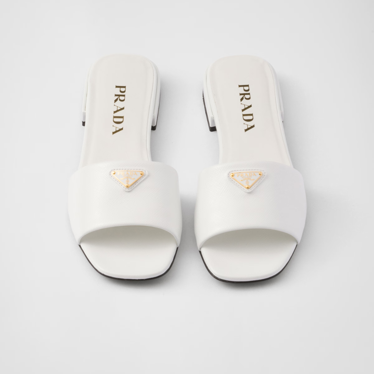 Saffiano patent leather slides – enameled metal triangle logo Leather sole with hot-stamped logo Leather-covered, – LUX VERSE Luxury Designer Fashion Outlet