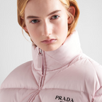 Re-Nylon Gabardine cropped down jacket – the lettering logo is framed by the iconic triangle that is interpreted – LUX VERSE Luxury Designer Fashion Outlet