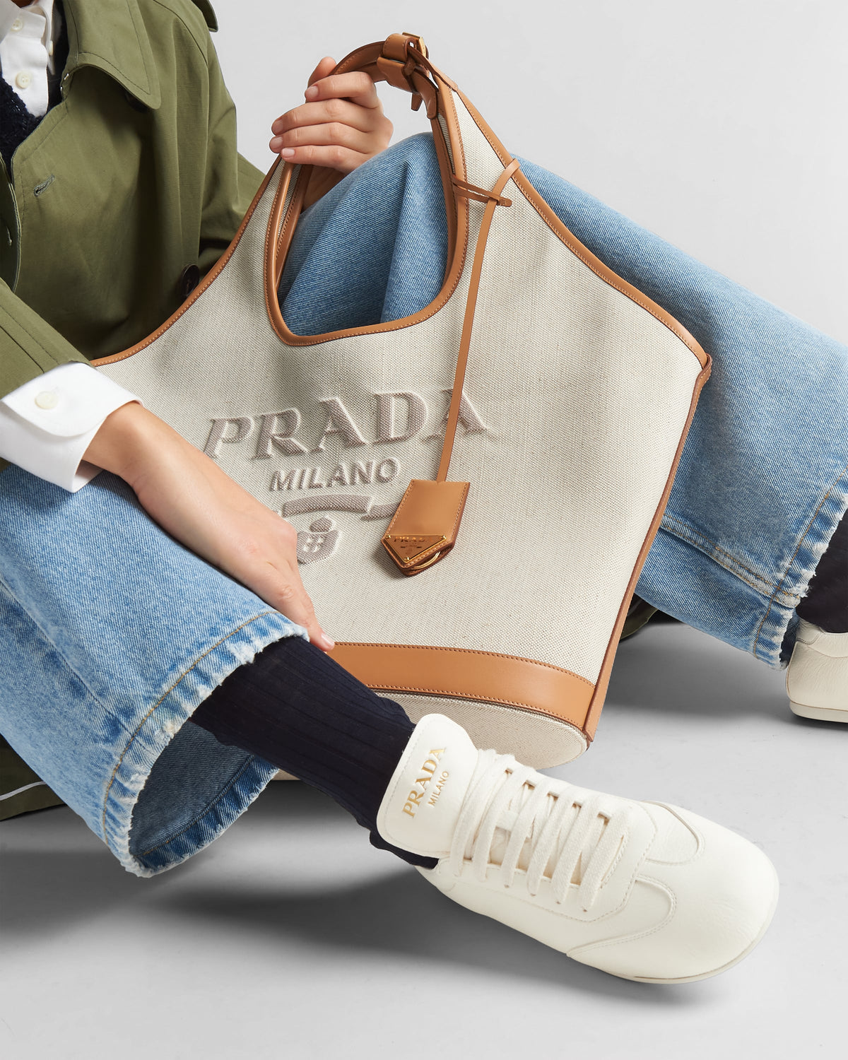 Leather sporty sneakers – the casual and versatile style is embellished with the embossed rubber triangle logo – LUX VERSE Luxury Designer Fashion Outlet