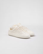 Leather sporty sneakers – upper with rubber toe cap Leather lining--Embossed rubber triangle logo Logo-print – LUX VERSE Luxury Designer Fashion Outlet
