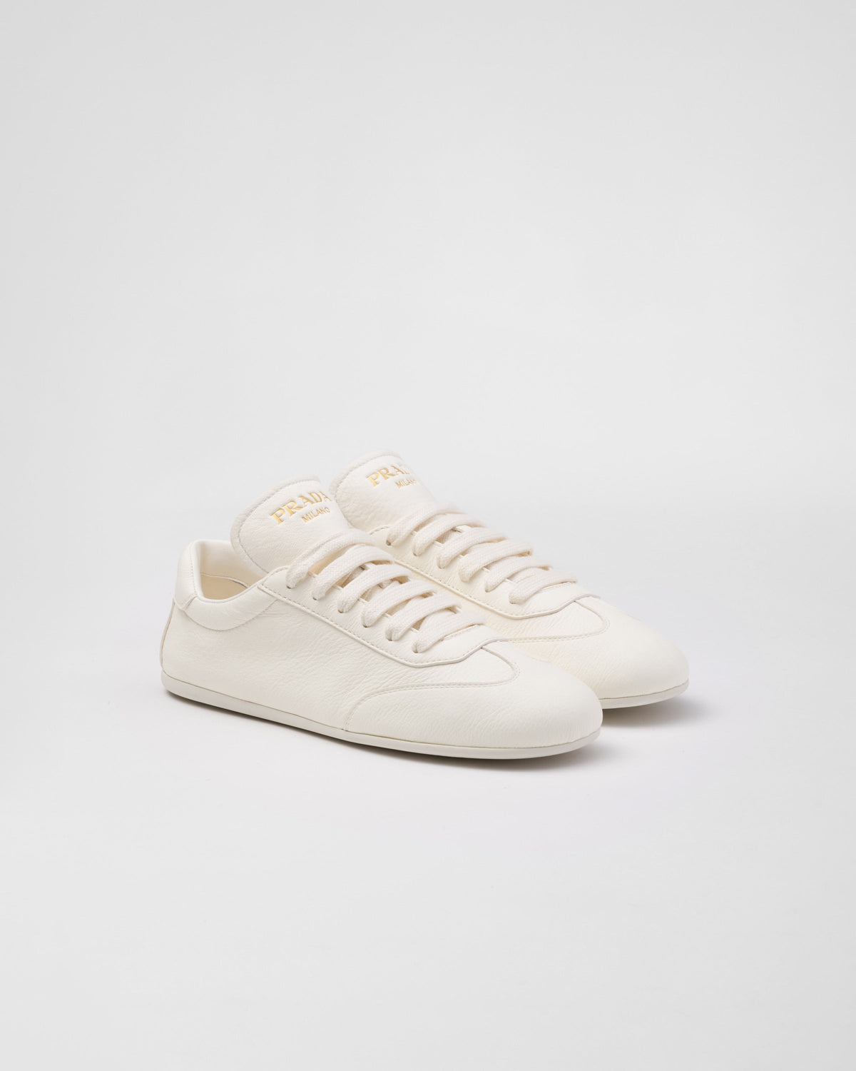 Leather sporty sneakers – upper with rubber toe cap Leather lining--Embossed rubber triangle logo Logo-print – LUX VERSE Luxury Designer Fashion Outlet