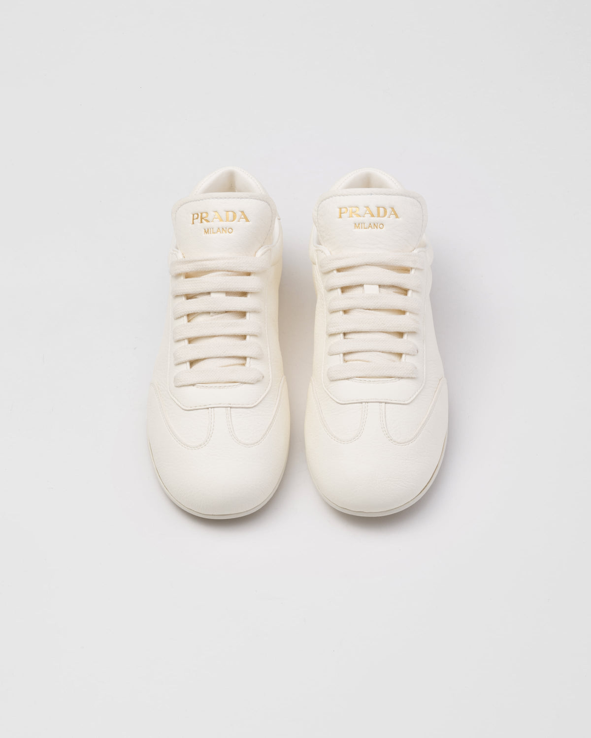 Leather sporty sneakers – upper with rubber toe cap Leather lining--Embossed rubber triangle logo Logo-print – LUX VERSE Luxury Designer Fashion Outlet