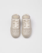Leather classic sneakers – the casual and versatile style is embellished with the embossed rubber triangle logo – LUX VERSE Luxury Designer Fashion Outlet