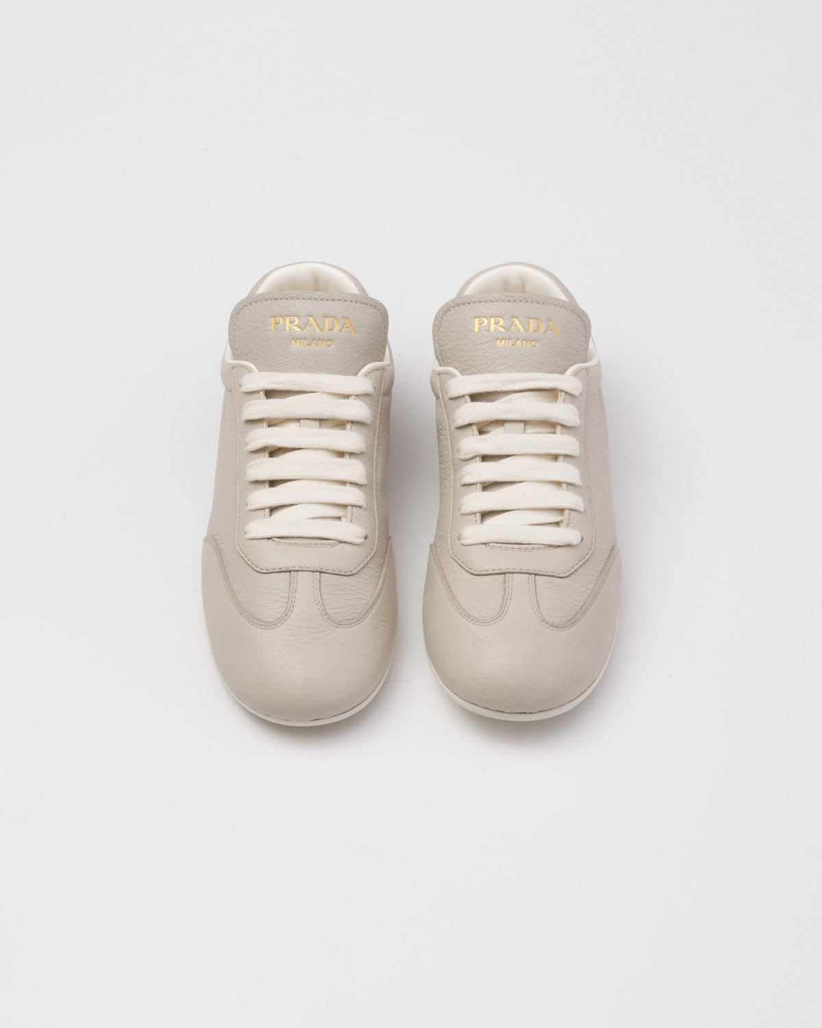 Leather classic sneakers – the casual and versatile style is embellished with the embossed rubber triangle logo – LUX VERSE Luxury Designer Fashion Outlet