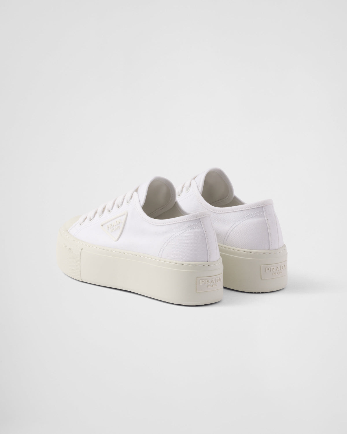 Laced fabric sneakers – the casual and versatile style is embellished with the embossed rubber triangle logo – LUX VERSE Luxury Designer Fashion Outlet