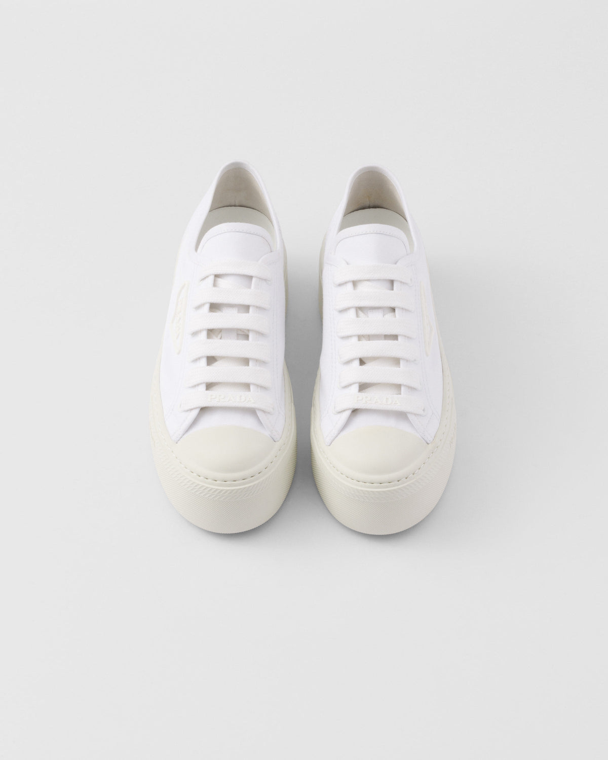 Laced fabric sneakers – upper with rubber toe cap Leather lining--Embossed rubber triangle logo Logo-print – LUX VERSE Luxury Designer Fashion Outlet