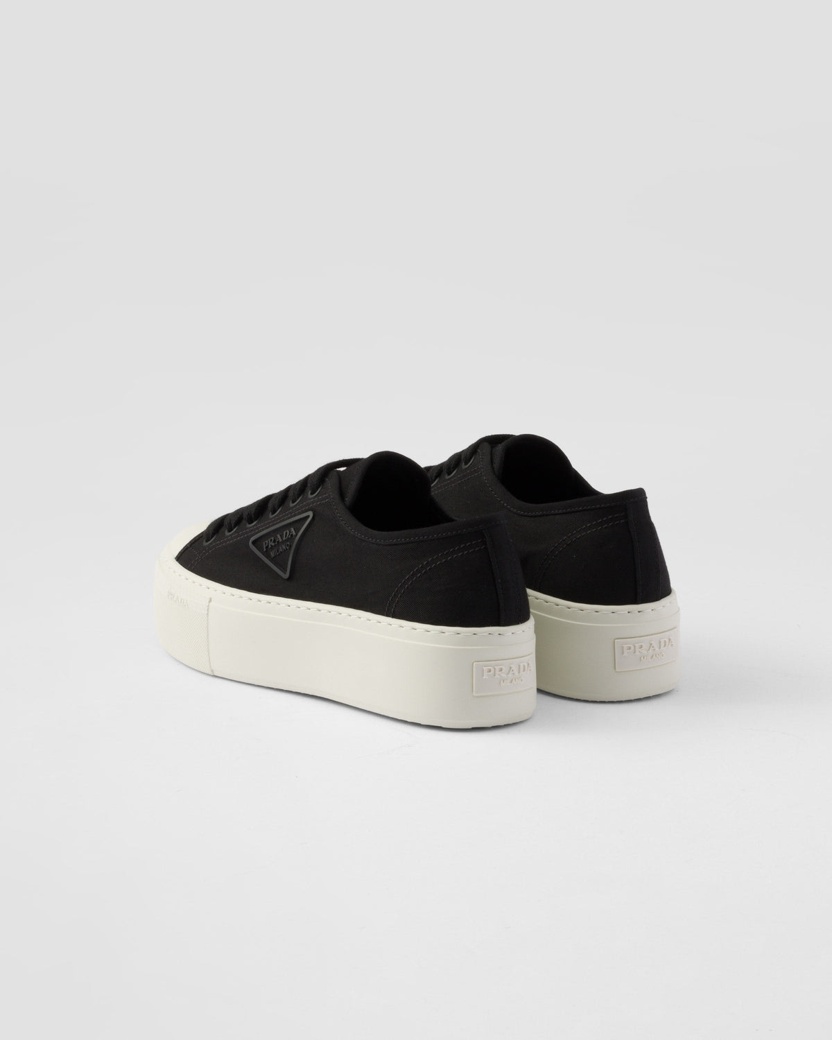 Fabric sneakers – the casual and versatile style is embellished with the embossed rubber triangle logo – LUX VERSE Luxury Designer Fashion Outlet