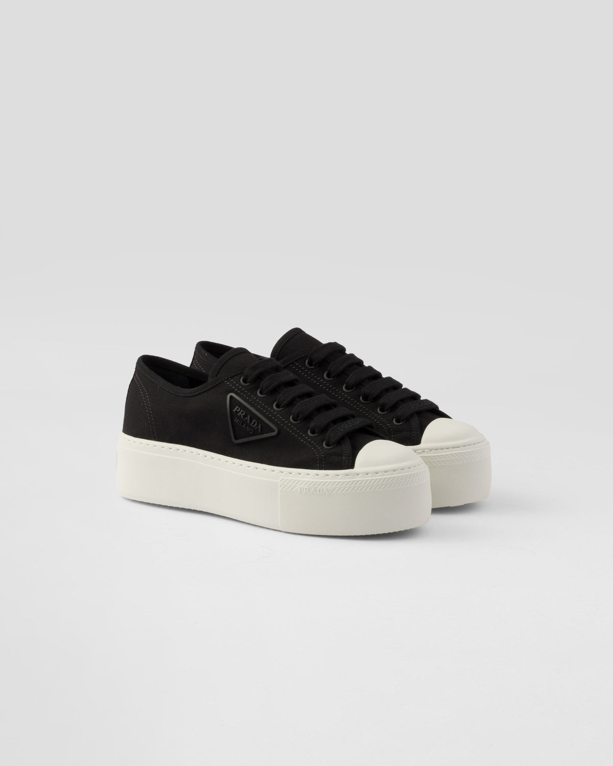 Fabric sneakers – upper with rubber toe cap Leather lining--Embossed rubber triangle logo Logo-print – LUX VERSE Luxury Designer Fashion Outlet
