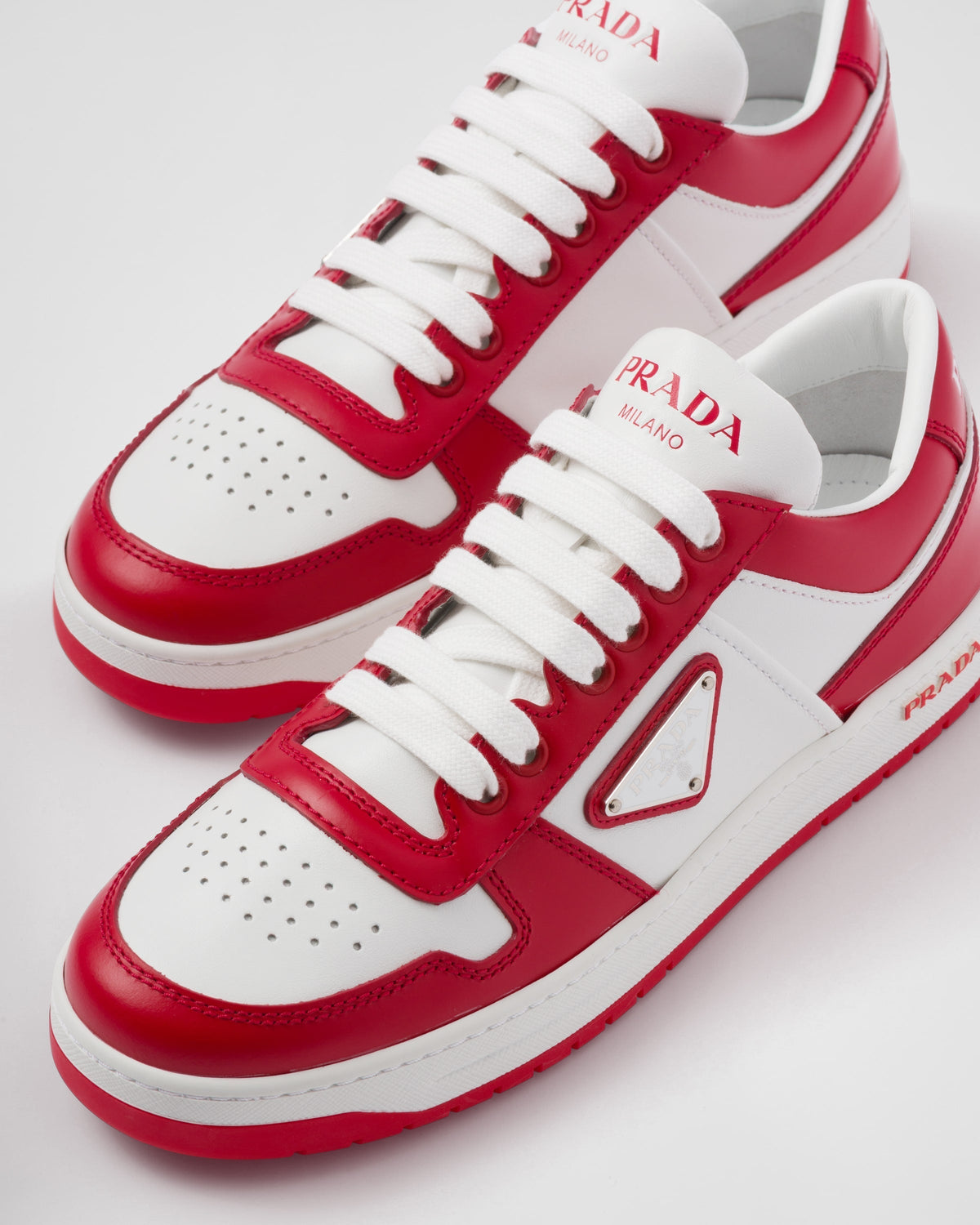 Downtown sporty leather sneakers – perforated motif on the upper Leather lining Enameled metal triangle logo Lace-ups – LUX VERSE Luxury Designer Fashion Outlet
