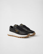 Leather silhouette sneakers – the shoe decorated with different interpretations of the logo is completed by – LUX VERSE Luxury Designer Fashion Outlet