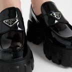 Monolith patent leather loafers – upper with leather band and metal triangle logo Apron with stitched raised edge – LUX VERSE Luxury Designer Fashion Outlet