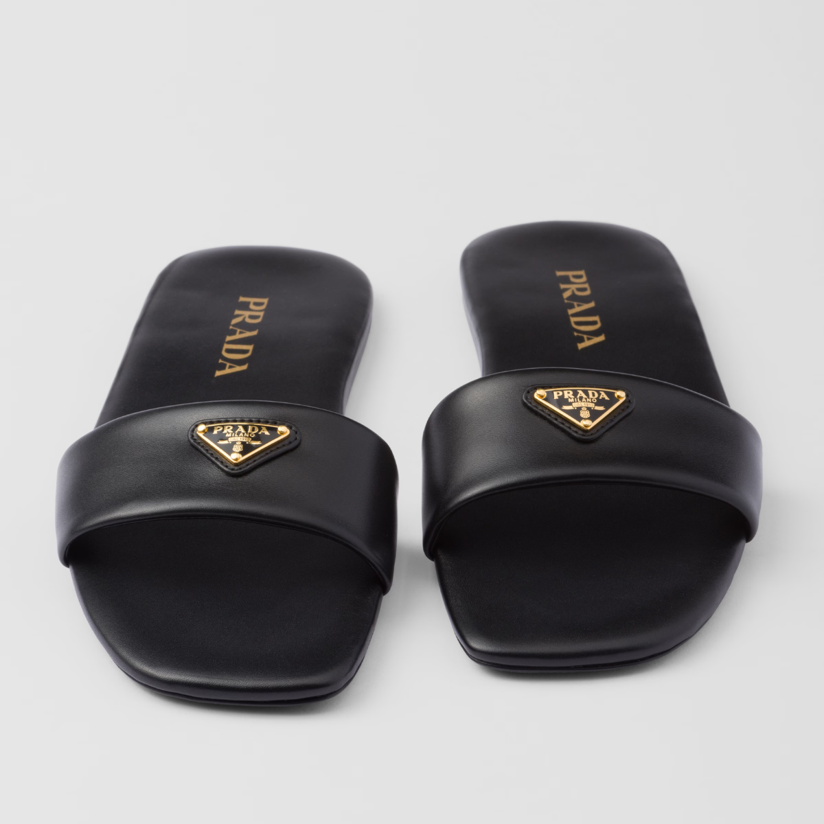 Leather slides – enameled metal triangle logo Monoblock leather sole, 5 mm, with hot-stamped logo – LUX VERSE Luxury Designer Fashion Outlet