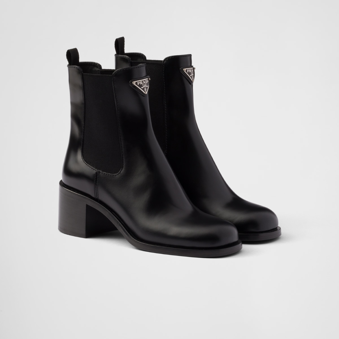 Brushed leather booties Black – upper with elasticized side gusset and pull tab Leather lining Enameled metal – LUX VERSE Luxury Designer Fashion Outlet