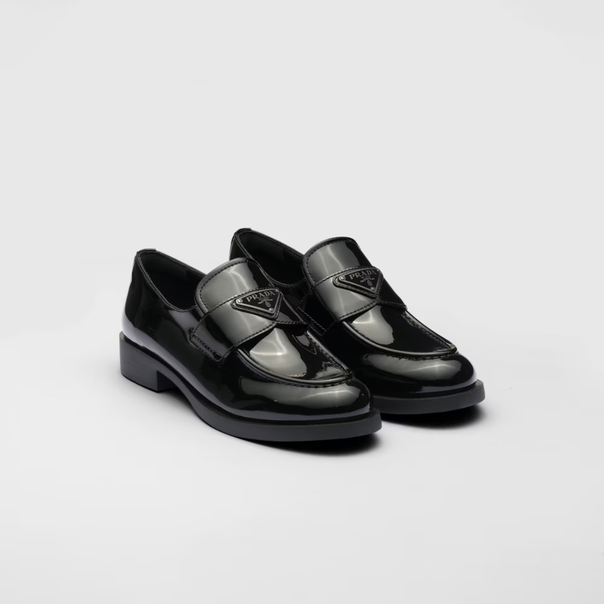 Patent Glossy Finish leather loafers – upper with leather band Enameled metal triangle logo Rubber monoblock sole – LUX VERSE Luxury Designer Fashion Outlet