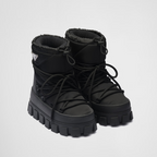 Re-Nylon gabardine après-ski boots – made of leather and nylon, an industrial fabric traditionally tied to the brand, – LUX VERSE Luxury Designer Fashion Outlet