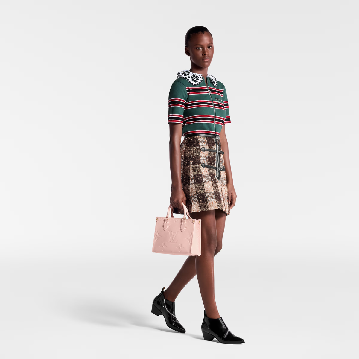 OnTheGo PM Pink Opale – the four riveted corner-tabs evoke the House’s famed trunks – LUX VERSE Luxury Designer Fashion Outlet