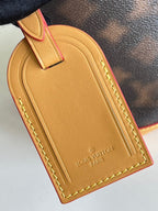 Braune und gelbe Beuteltasche