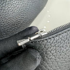 Schultertasche in Schwarz und Grün