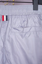 Graue Baumwoll-Jogginghose mit Vier-Streifenmuster – Herren