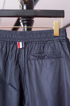 Graue Baumwoll-Jogginghose mit Vier-Streifenmuster – Herren