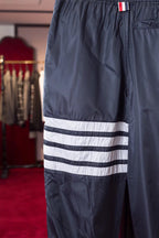 Graue Baumwoll-Jogginghose mit Vier-Streifenmuster – Herren