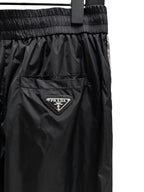 Schwarze Nylon-Jogginghose für Herren mit Seitenstreifen