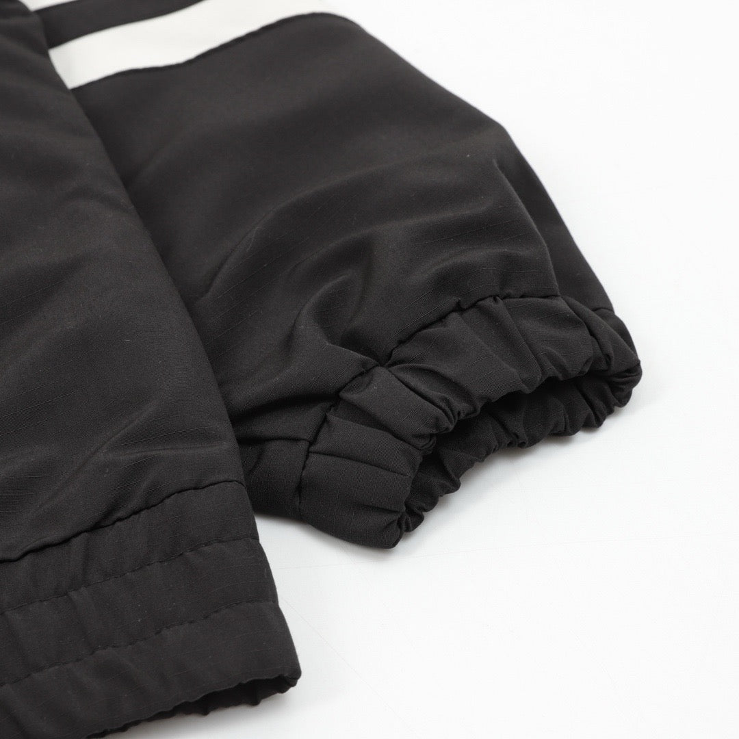 Schwarze Nylon-Trainingshose mit Einsätzen – Herren