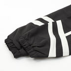 Schwarze Nylon-Trainingshose mit Einsätzen – Herren