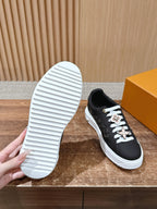 Schwarze Leder-Monogramm-Low-Top-Sneaker – Damen