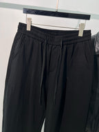 Schwarze, elastische weite Beinhose aus Baumwolle – Herren
