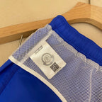 Orangefarbene Badeshorts aus schlichtem Nylon – Herren