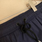 Orangefarbene Badeshorts aus schlichtem Nylon – Herren