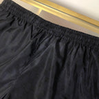 Schwarze Nylon-Sporthose mit Seitenstreifen – Herren