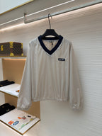 Cremefarbenes Langarmshirt aus Baumwolle mit Kontrastkragen – Damen
