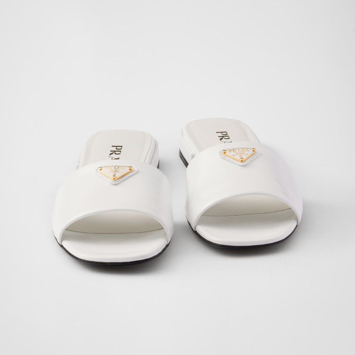 Saffiano patent leather slides – the sophisticated and versatile style defined by clean, sleek lines is enriched – LUX VERSE Luxury Designer Fashion Outlet