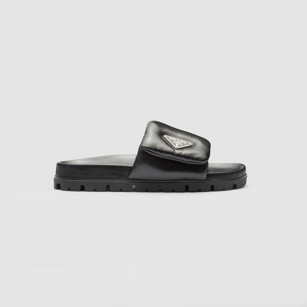 Soft padded nappa leather slides – these padded nappa leather slides with a nineties feel have a minimalist, – LUX VERSE Luxury Designer Fashion Outlet