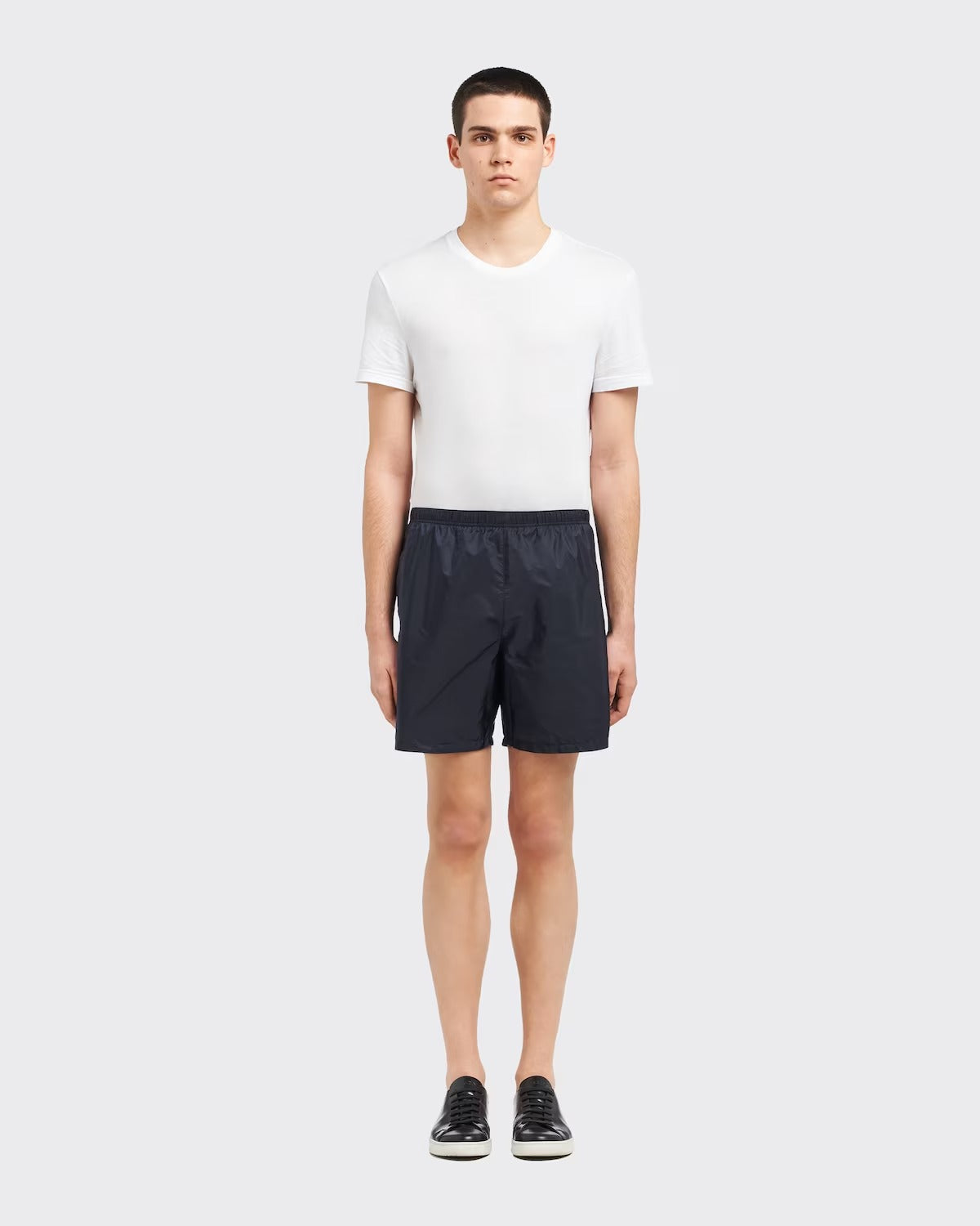 Re-Nylon swim trunks – the style with a classic silhouette, characterized by the elasticized waistband, is – LUX VERSE Luxury Designer Fashion Outlet