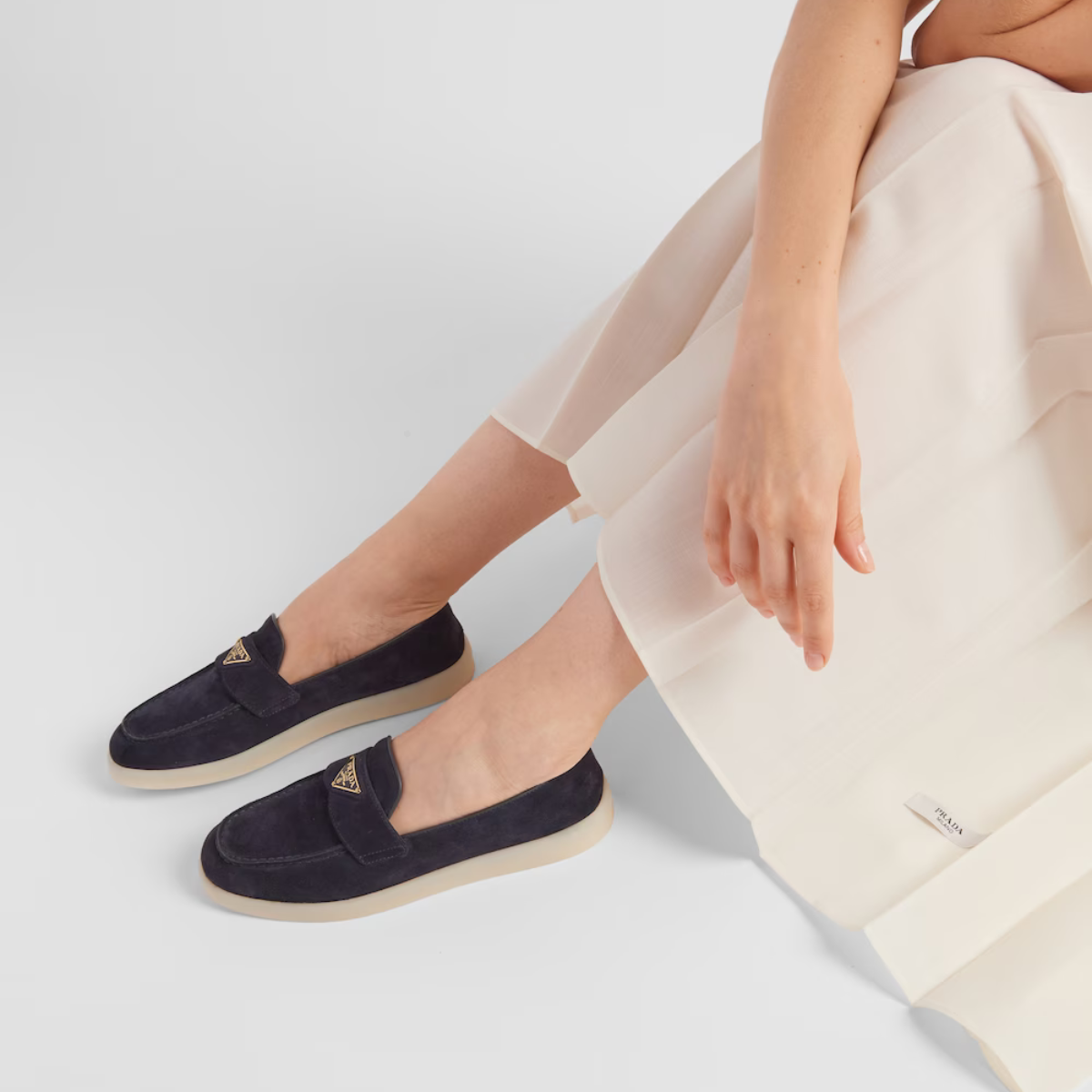 Suede leather loafers – the enameled metal triangle logo embellishes the band, while the rubber sole adds – LUX VERSE Luxury Designer Fashion Outlet