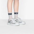 ID Sneaker – the textured-effect French blue'CHRISTIAN PARIS'signature adorns the rear – LUX VERSE Luxury Designer Fashion Outlet