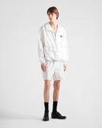 Re-Nylon swim trunks – the style with a classic silhouette, characterized by the elasticized waistband, is – LUX VERSE Luxury Designer Fashion Outlet
